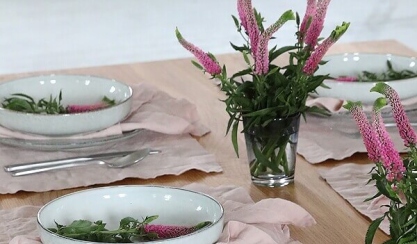 Elegant dining table set with linen table textiles