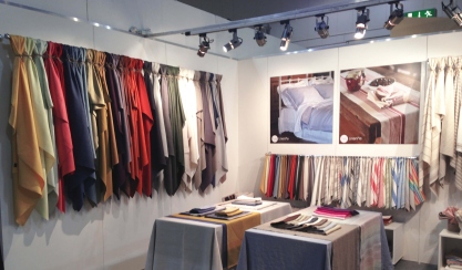 LinenMe textiles displayed at a trade-show stand
