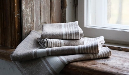 Linen guest bathroom towels prepared for visitors