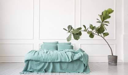 White linen bedding in a bright bedroom