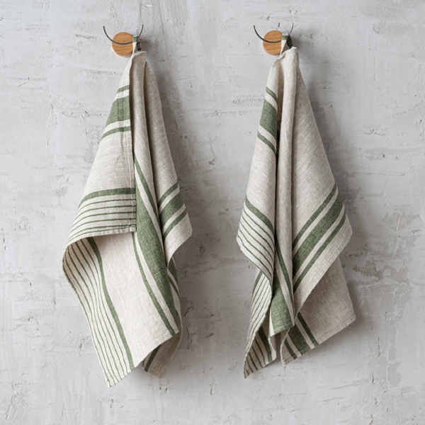 Set of two forest green and natural striped linen tea towels hanging on wall hooks