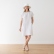 Woman wearing a dress made from prewashed optical-white plain linen