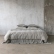 Bed dressed in taupe stone-washed linen bedding