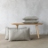 Taupe stone-washed linen cushions beside a wooden bench