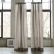 Taupe stone-washed linen curtains in front of large windows