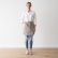 Woman wearing a taupe stone-washed linen waist apron
