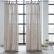 Natural linen curtains tied at a window