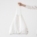 Optical-white Terra linen tote bag held by a person